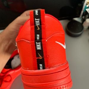 Red Nike shoe brand new has never been worn once.